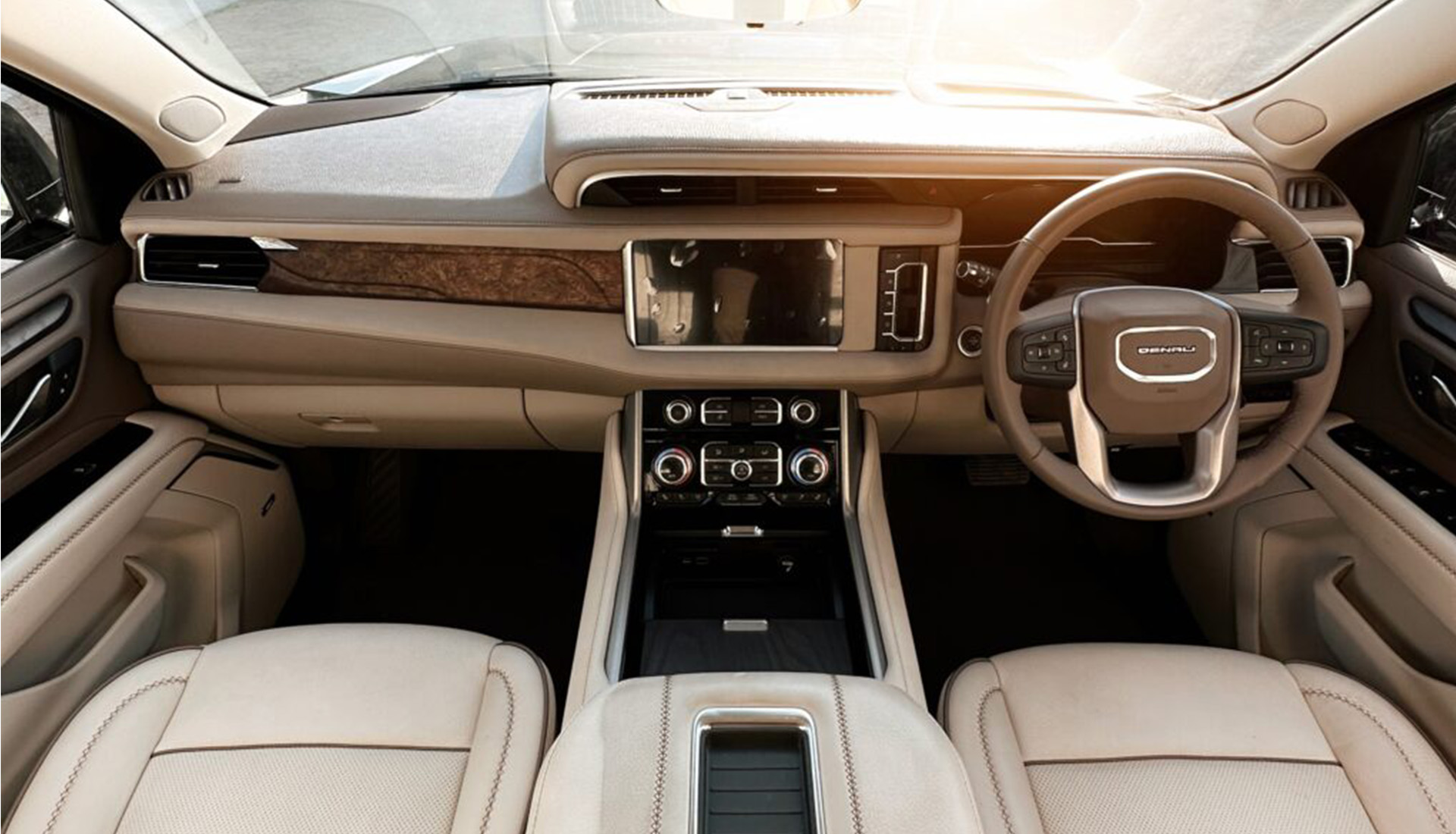 Luxurious beige interior of a modern Denali SUV.