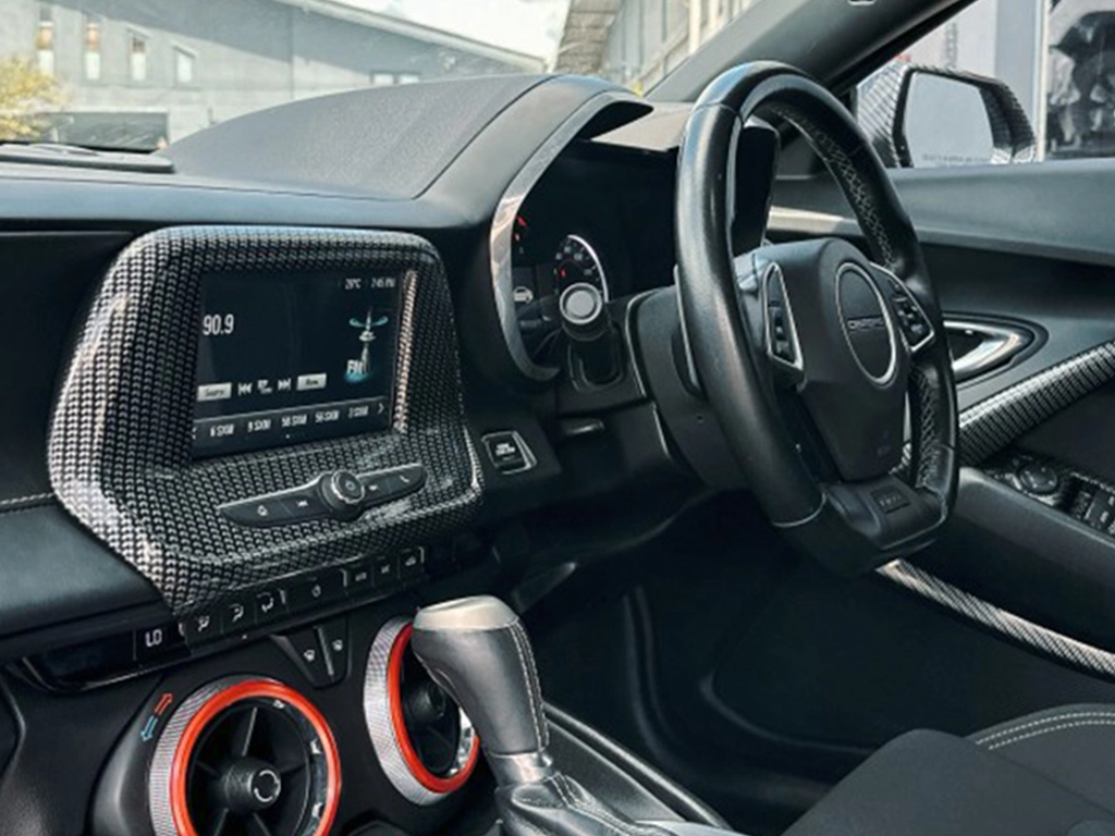 Modern car dashboard and steering wheel.