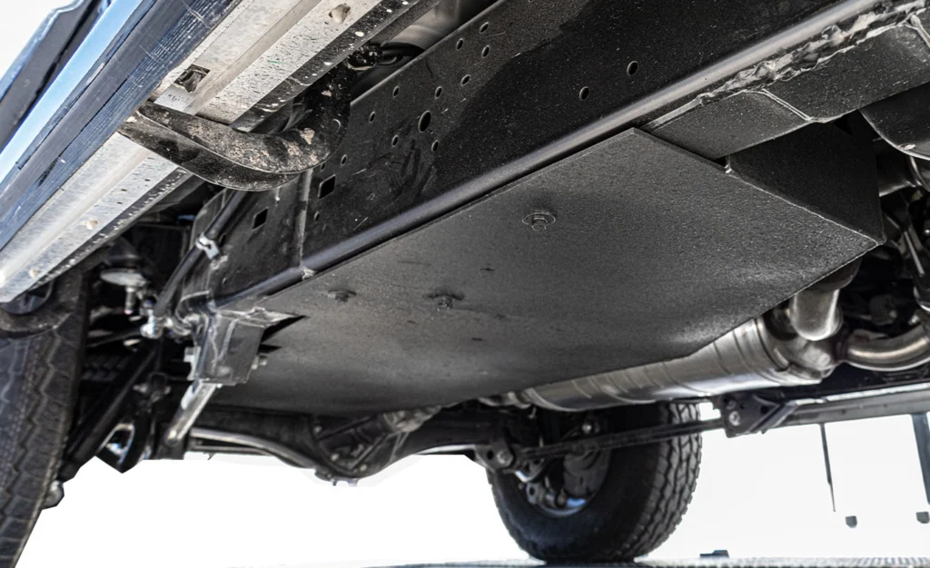 Undercarriage view of a rugged off-road vehicle.