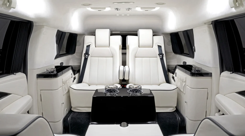 Luxury private jet interior with comfortable white seating.