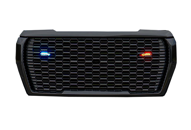 Front view of a black car grille with lights.