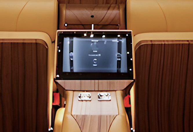 Luxury car interior with leather seats and entertainment system.