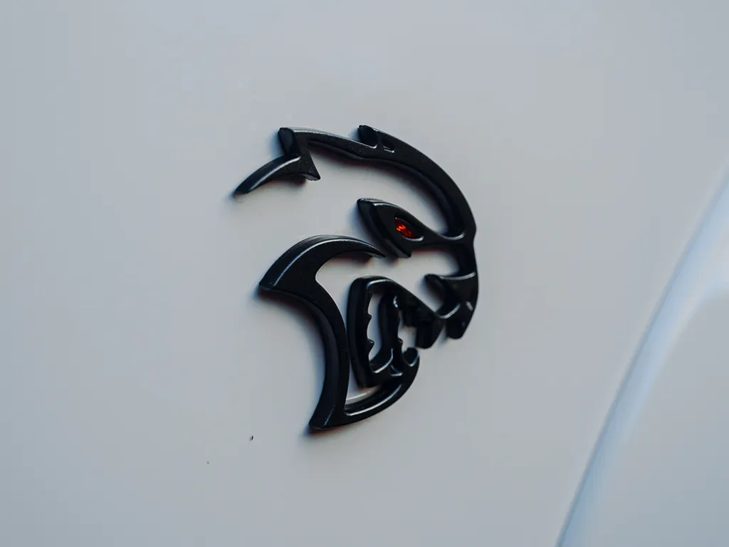 close up of dodge hellcat logo