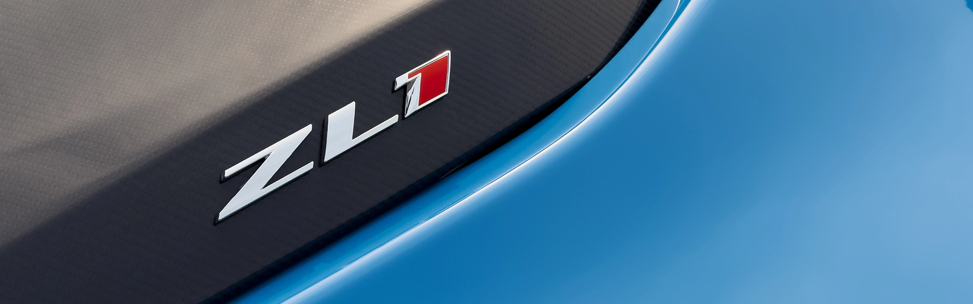 Close-up of blue car with ZL1 emblem.