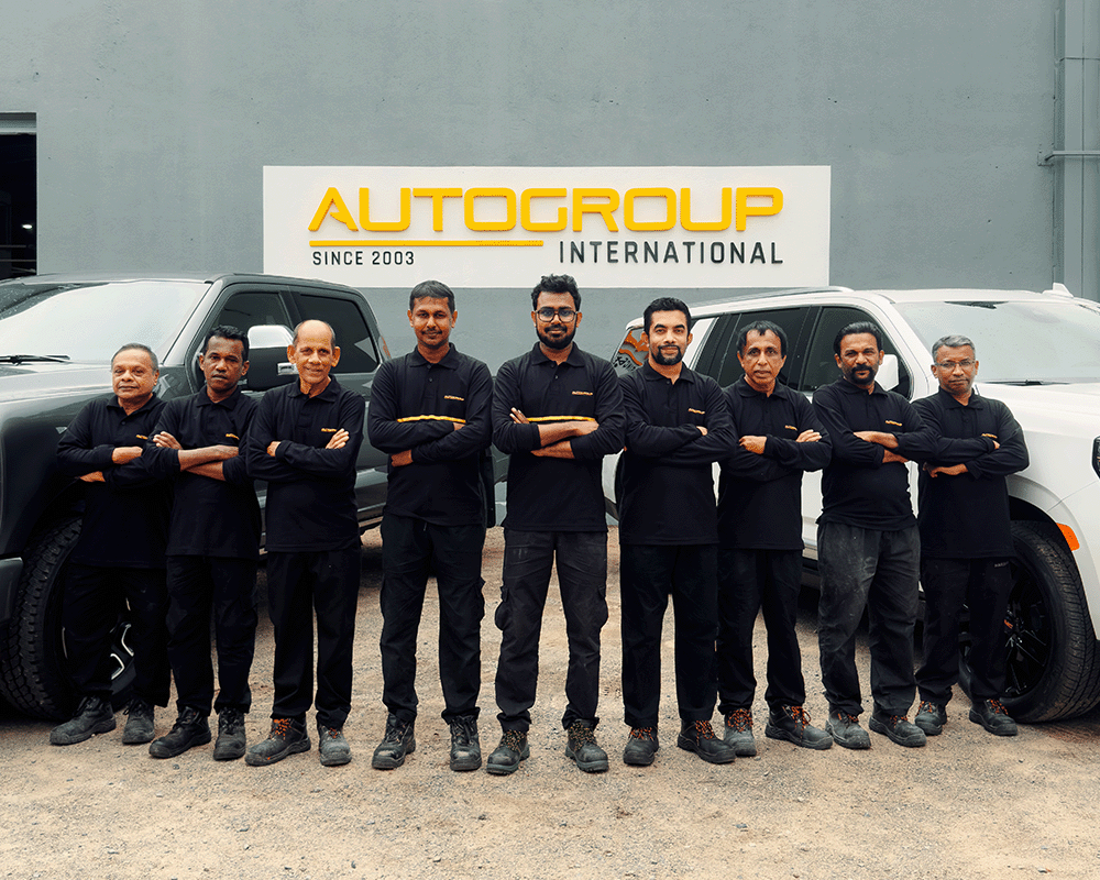 team lined up our front of autogroup factory