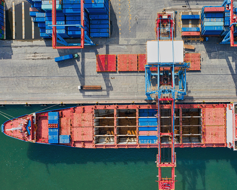 birds-eye view of shipping port with containers
