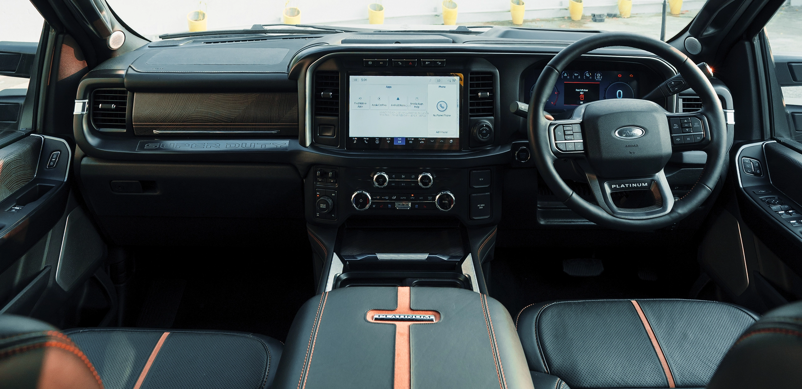 Ford Super Duty interior showing dashboard and steering wheel.
