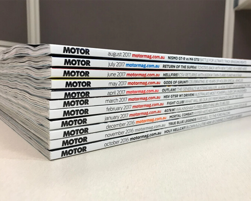 Stack of Motor Magazine issues from 2016 to 2017.