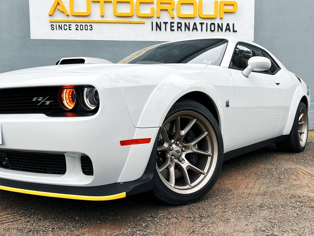 dodge challenger white side profile converted to right hand drive by autogroup