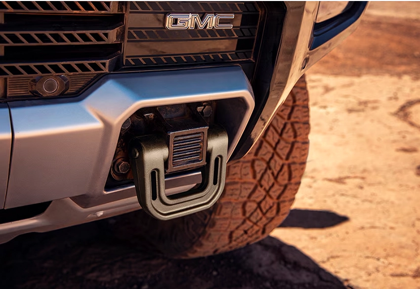 Close-up of GMC hummer ev pickup front bumper and tire