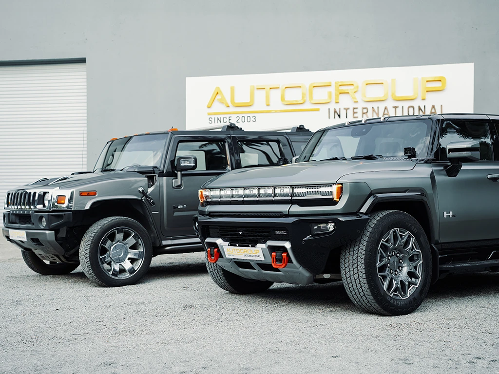 Hummer H2 and Hummer EV pictured side by side at Autogroup international right hand drive conversion at factory