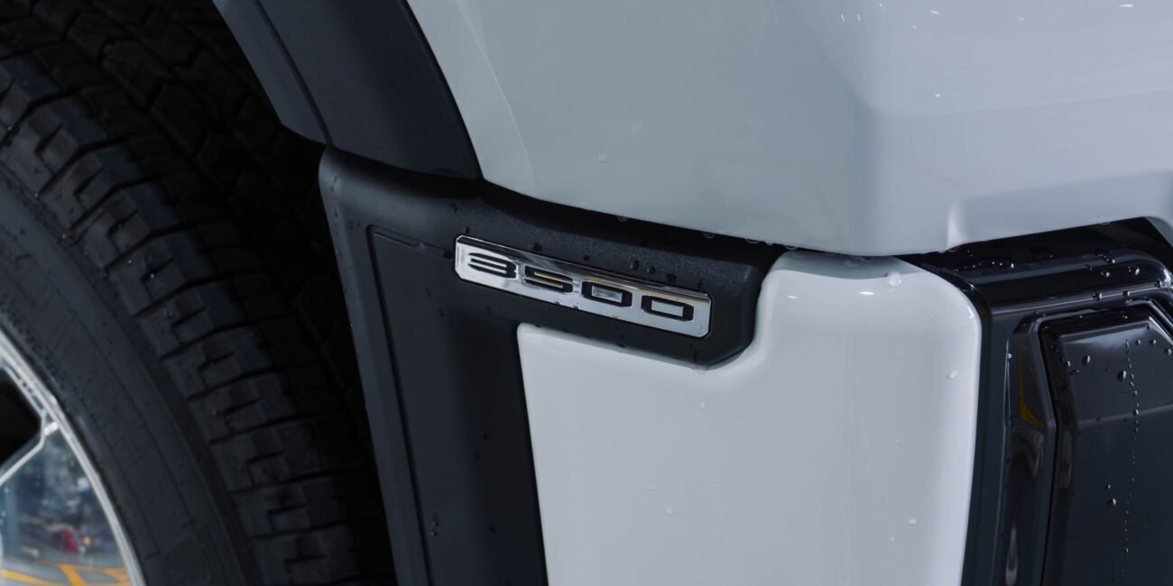 ight-hand drive 2025 GMC Sierra 3500 Denali Ultimate DRW in Summit White, Alpine Umber. 6.6L Duramax, Allison 10-speed, luxury heavy-duty capability from Autogroup International