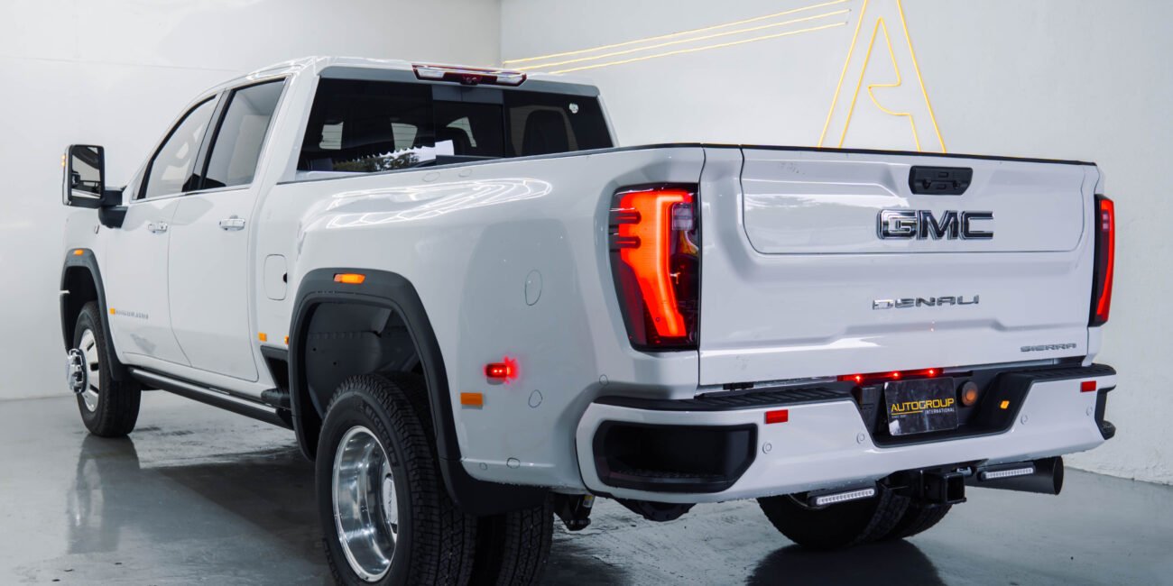 ight-hand drive 2025 GMC Sierra 3500 Denali Ultimate DRW in Summit White, Alpine Umber. 6.6L Duramax, Allison 10-speed, luxury heavy-duty capability from Autogroup International