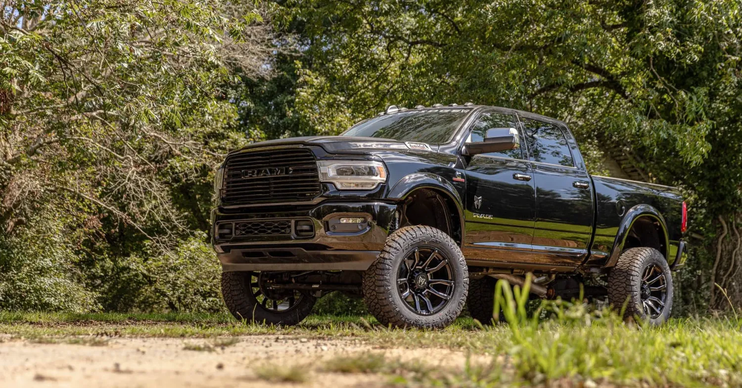 Black lifted pickup truck parked outdoors