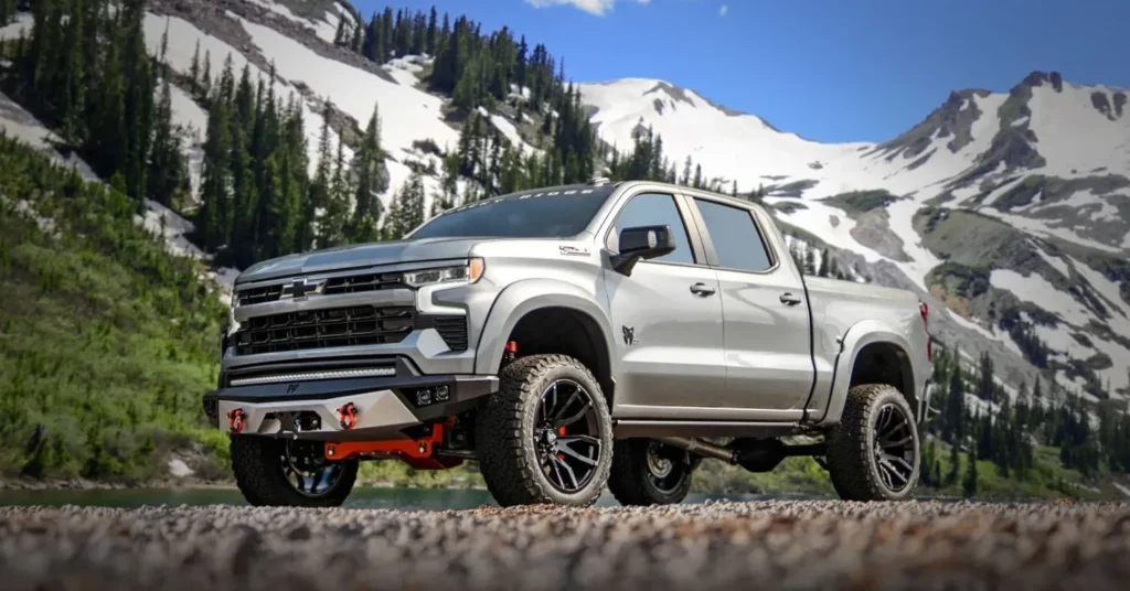 Rocky Ridge Silver pickup truck in snowy mountain landscape