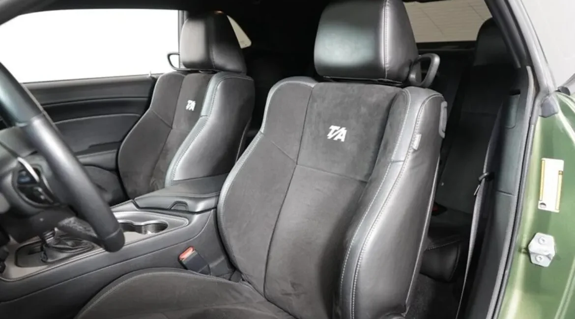 Black leather car interior with T/A logo seats