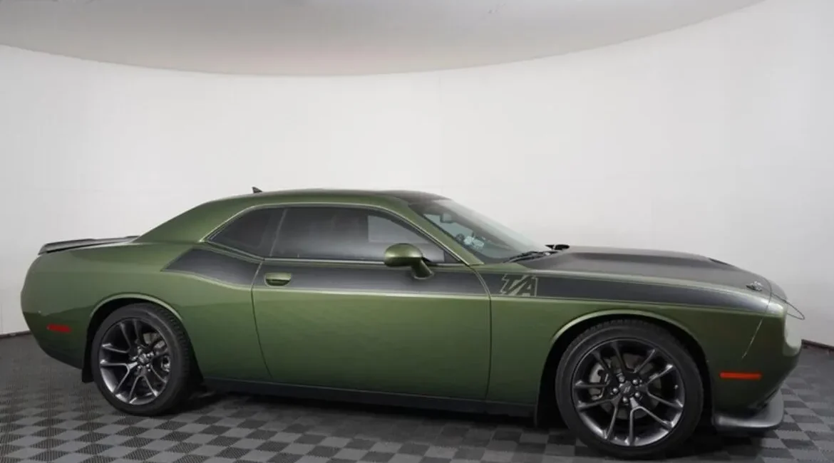 Green Dodge Challenger muscle car side view