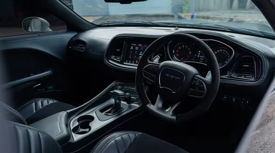 Modern sports car interior with black leather seats