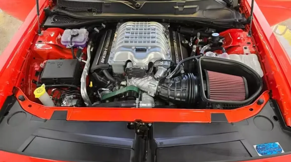 Supercharged HEMI engine in red muscle car