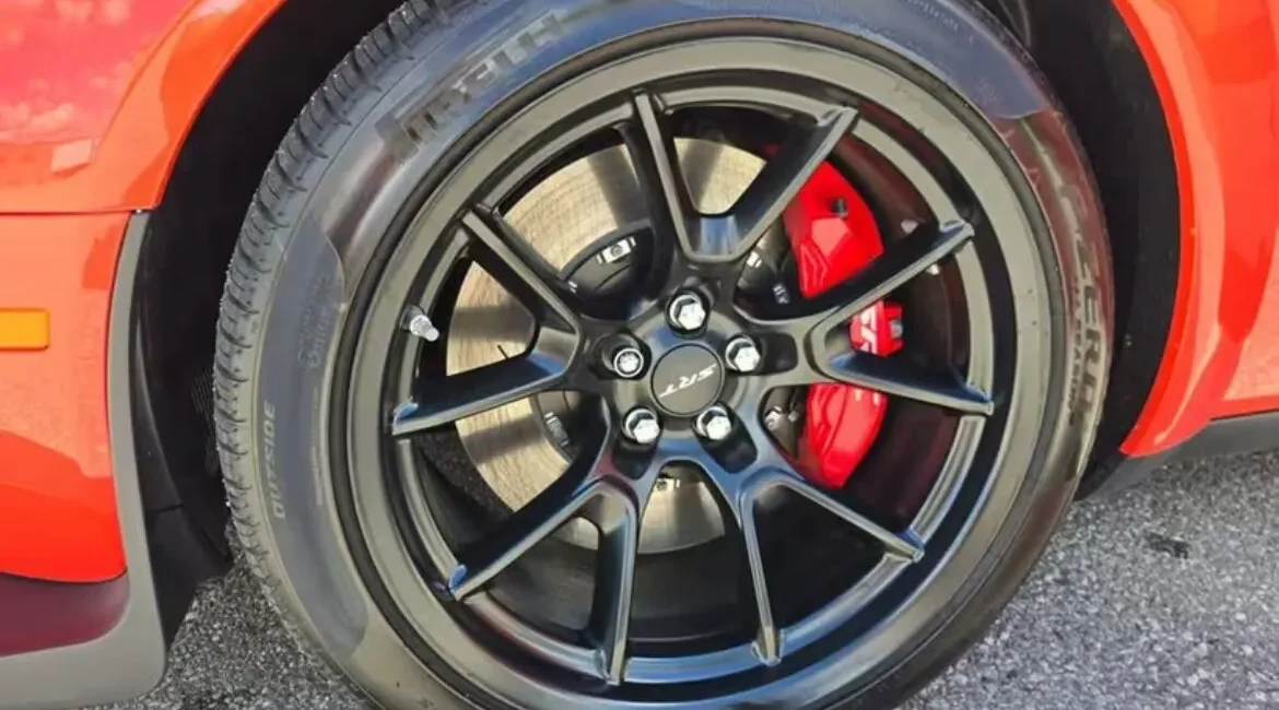 Black alloy wheel with red brake caliper