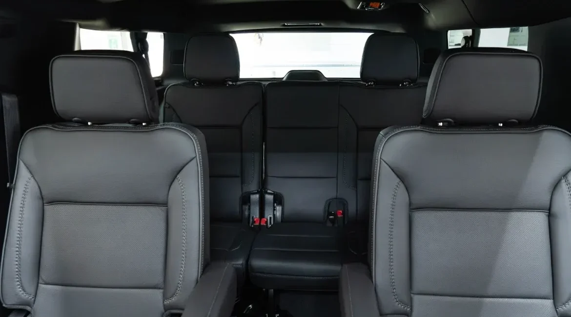 Black leather interior of SUV with three rows