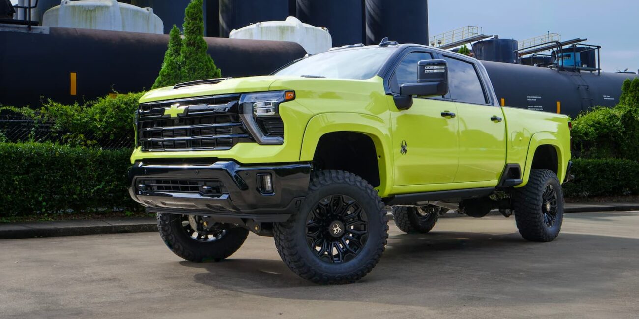 Lifted bright green Chevrolet truck parked outdoors