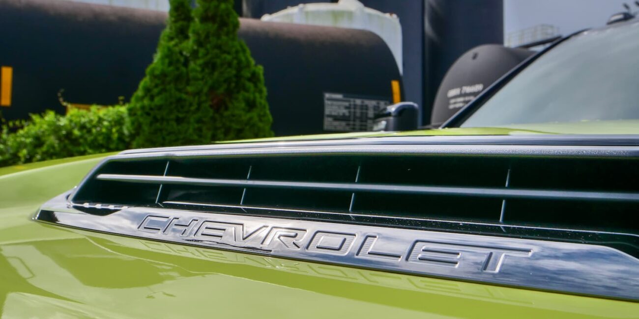 Green Chevrolet car hood close-up with logo