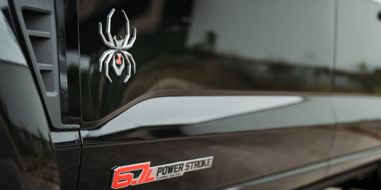 Black truck with spider emblem and 6.7L badge