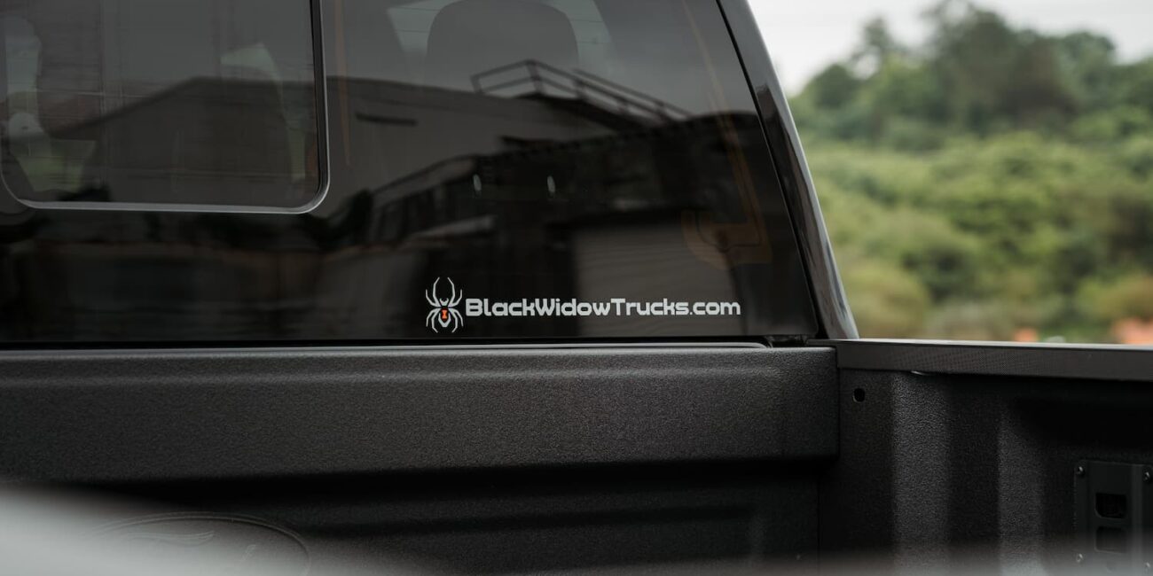 Black Widow Trucks logo on pickup rear window