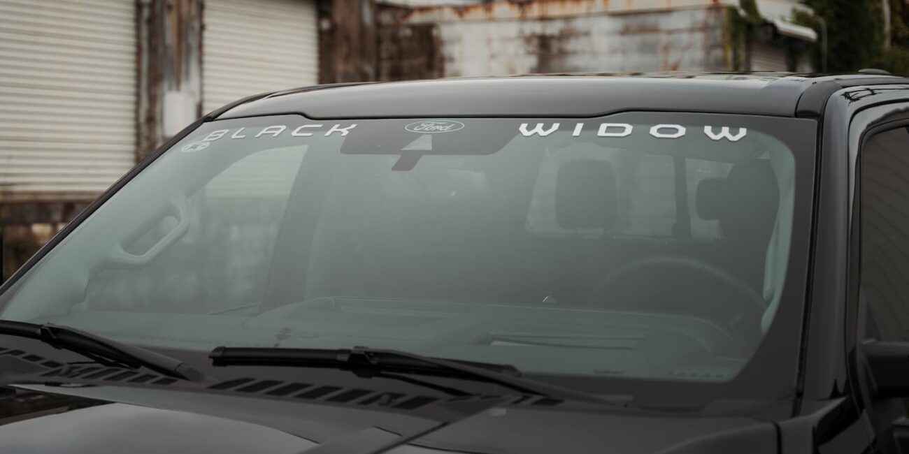 Black Widow decal on Ford truck windshield