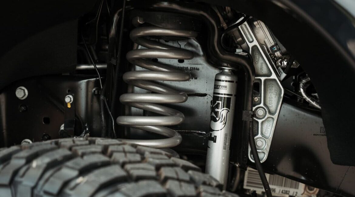 Close-up of vehicle suspension system and tire