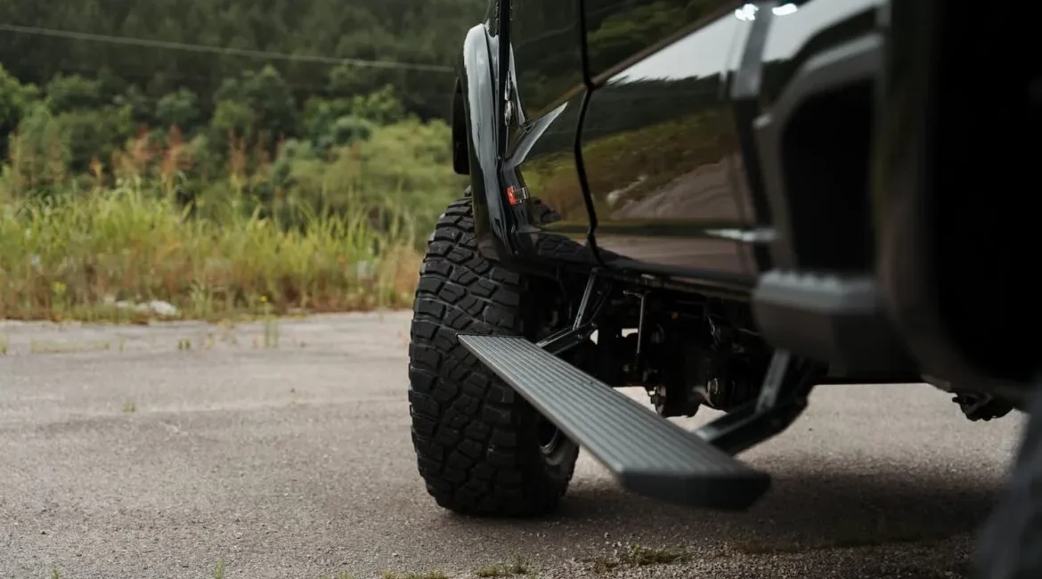 Black off-road truck with extended side step
