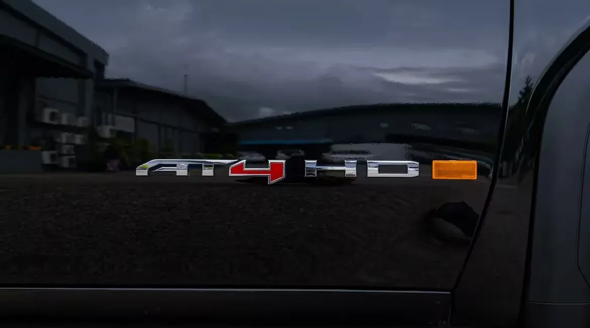 AT4 HD chrome badge on black truck