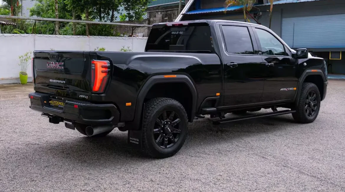 Black GMC Sierra pickup truck parked outdoors
