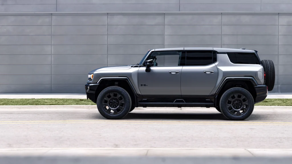 Silver electric SUV parked on city street