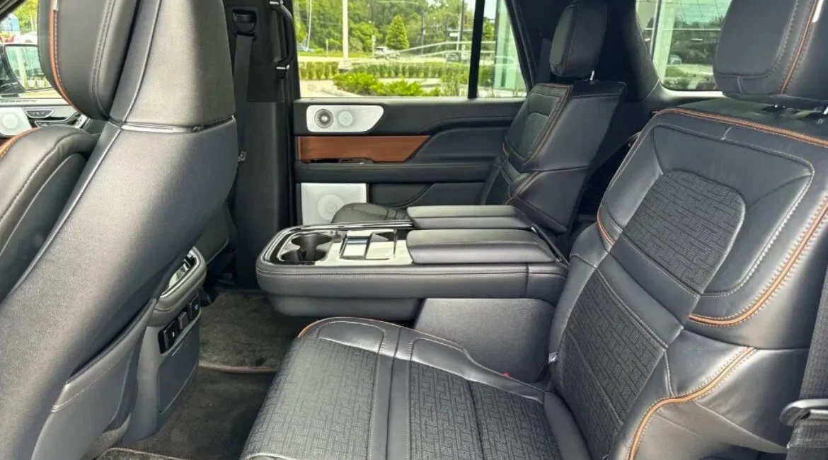 Luxury SUV backseat interior with leather upholstery