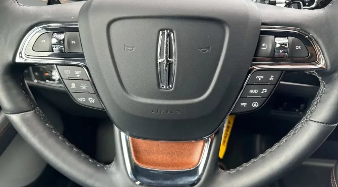 Lincoln car steering wheel controls close-up