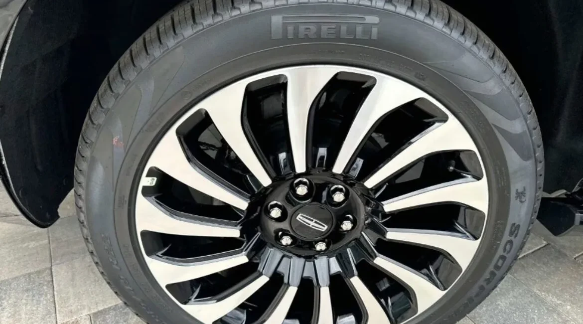 Close-up of Pirelli car tire and alloy wheel