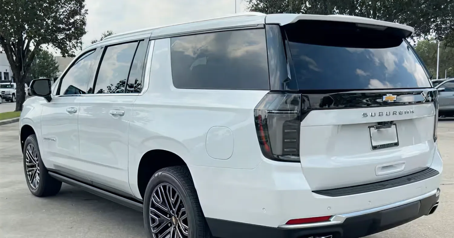 White Chevrolet Suburban SUV parked outdoors