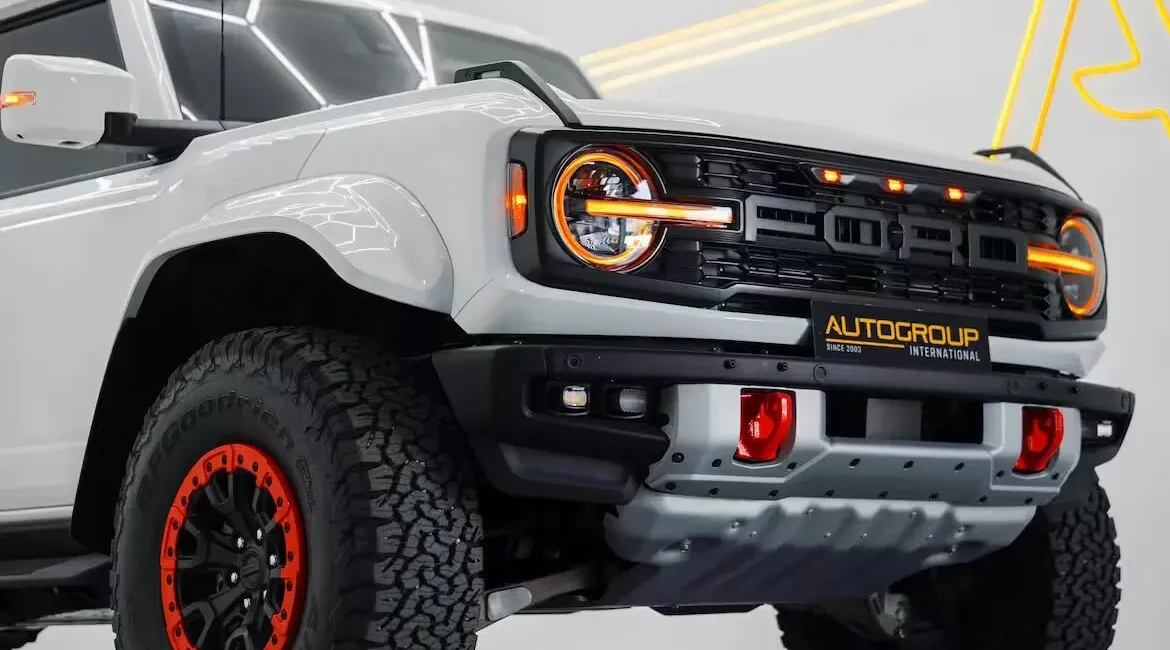 White off-road SUV with rugged tires and grille