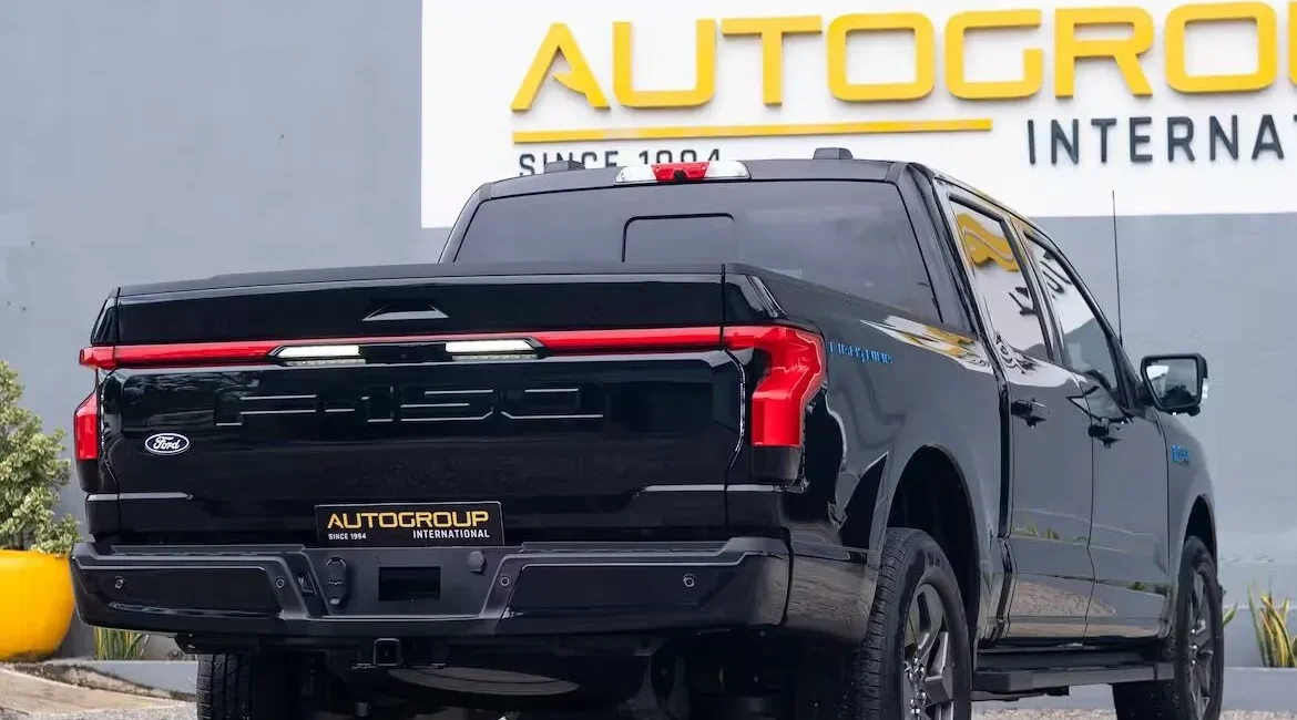 Black Ford F-150 Lightning truck rear view