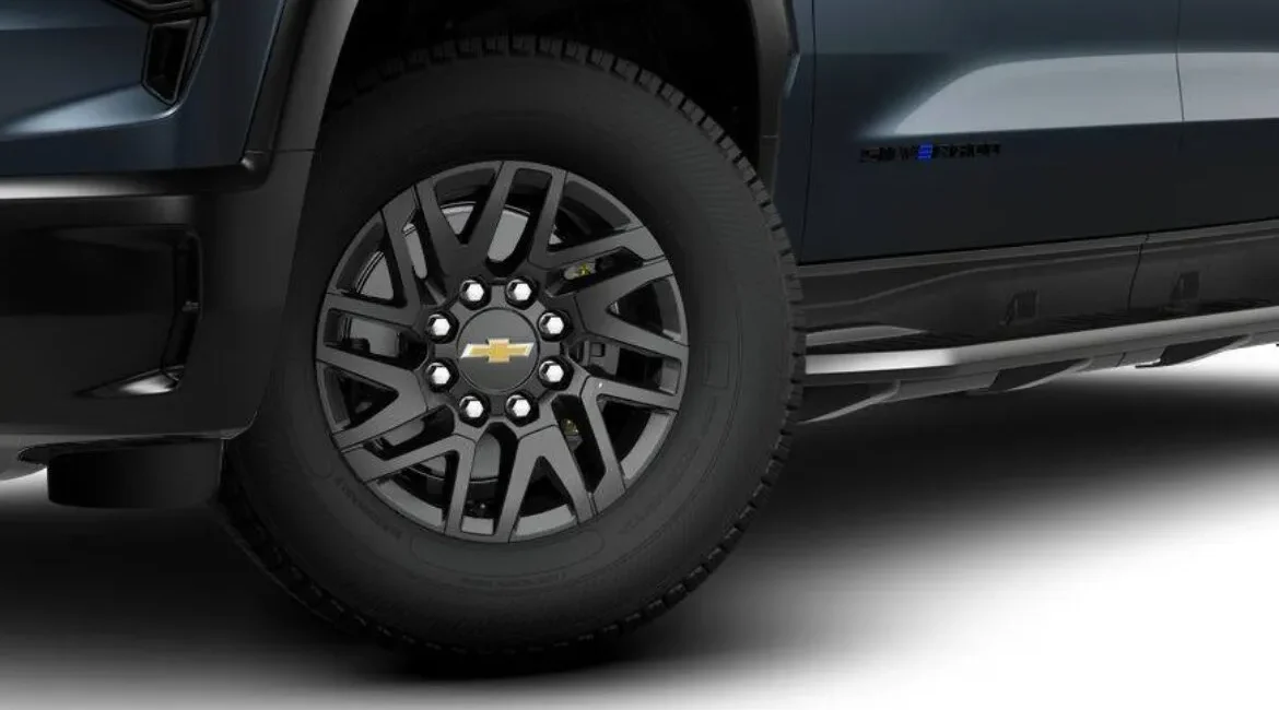 Black alloy wheel on blue Chevrolet truck