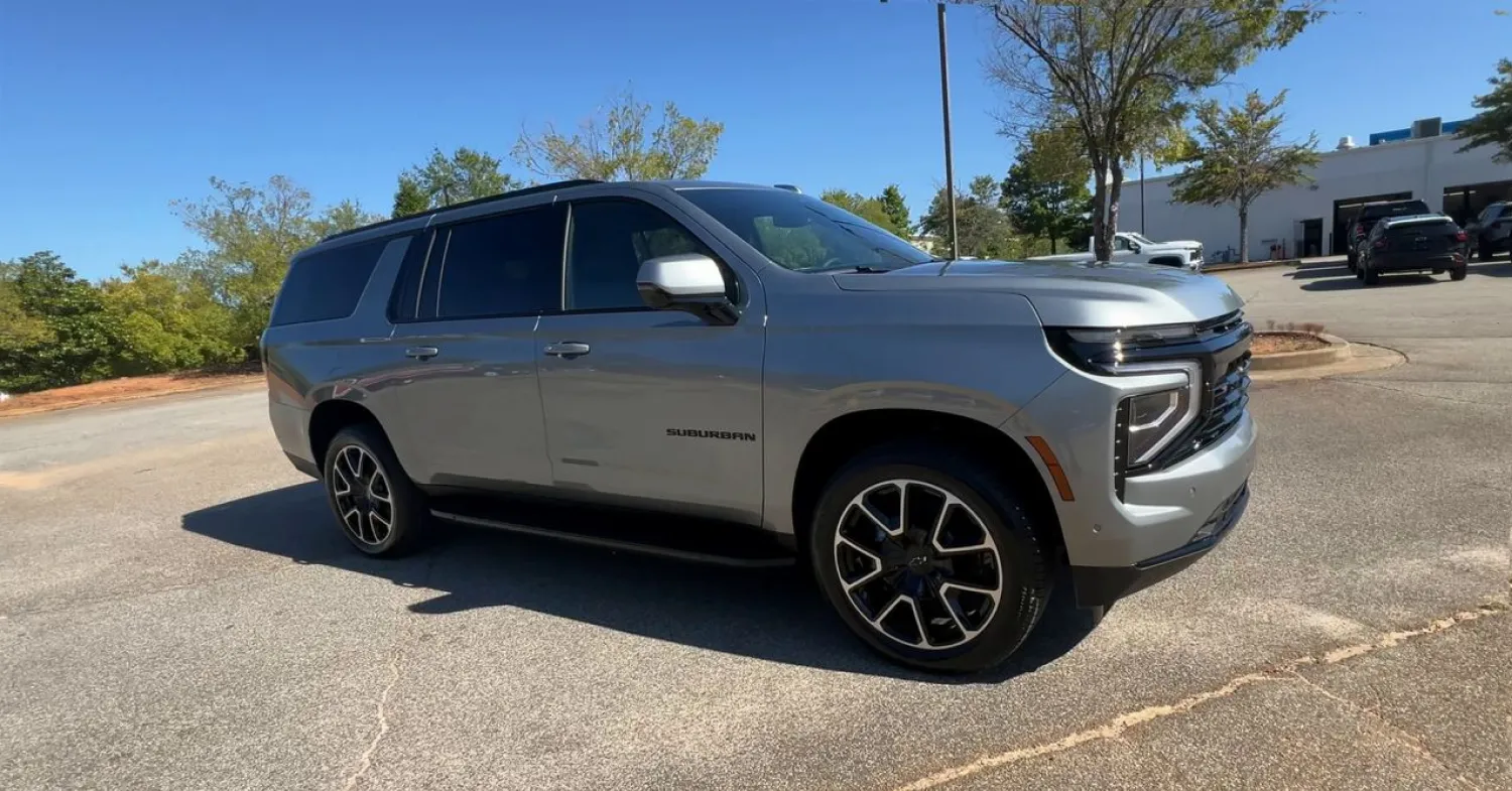 Silver SUV parked in a sunny parking lot