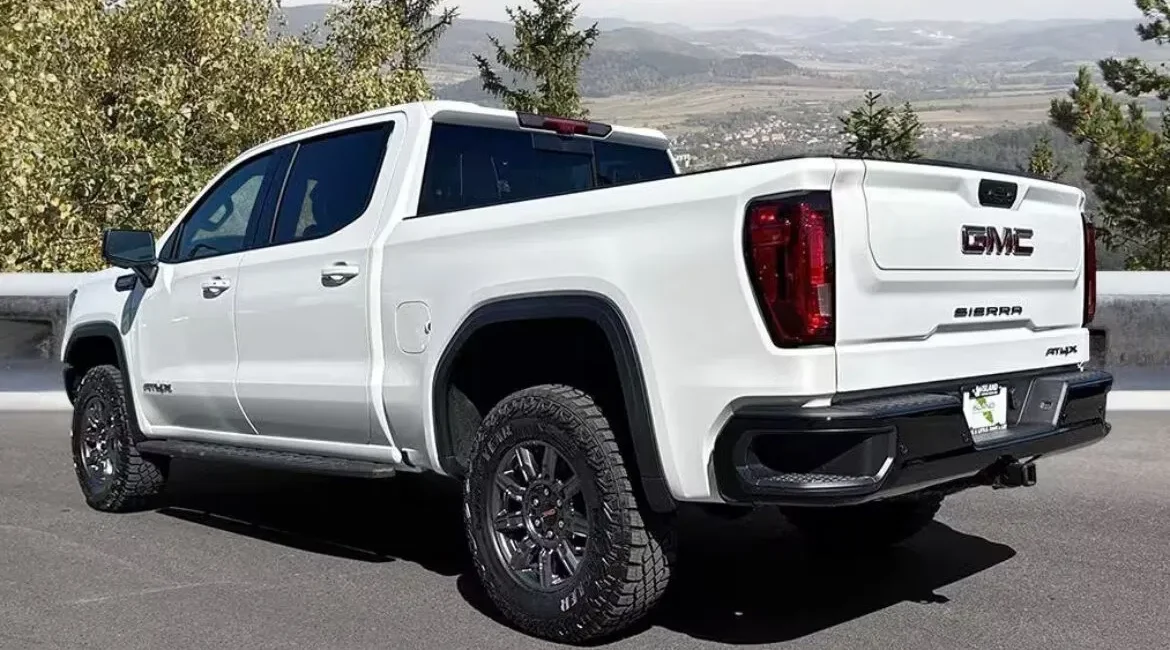 White GMC Sierra pickup truck parked outdoors