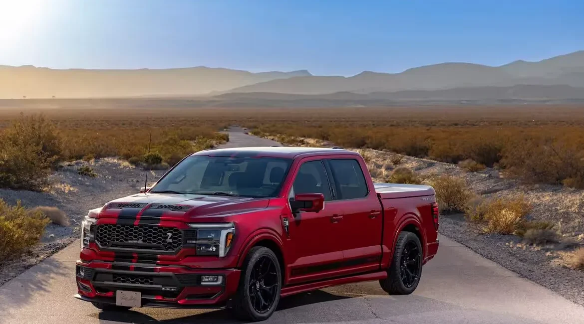 Red pickup truck on desert road