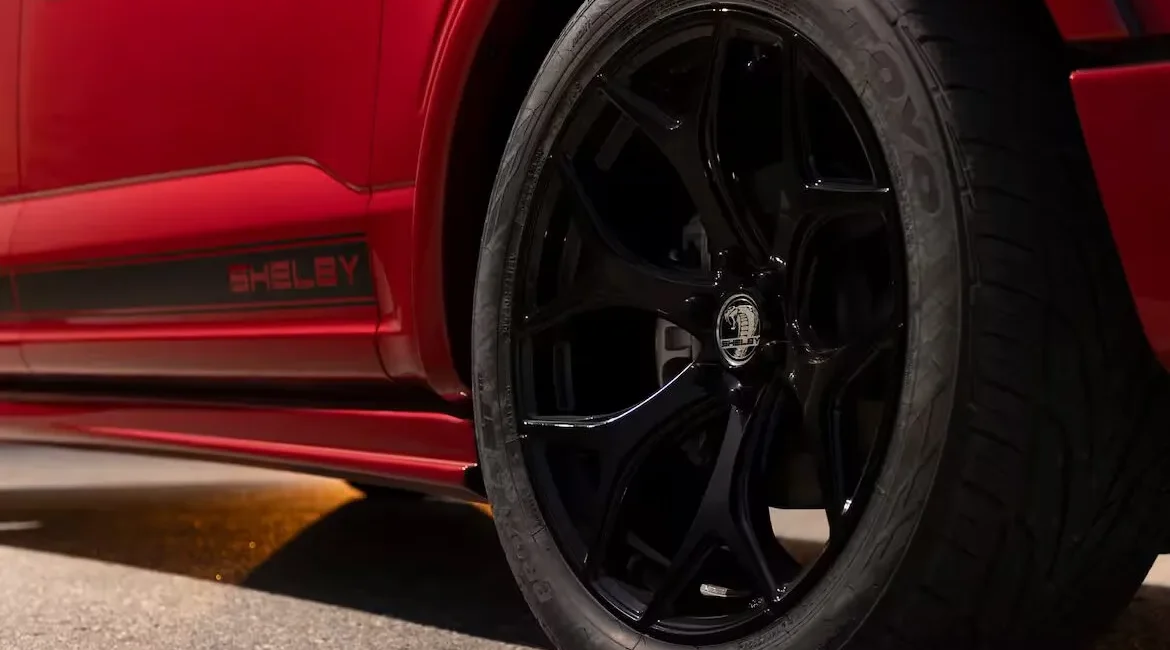 Close-up of red Shelby car wheel.