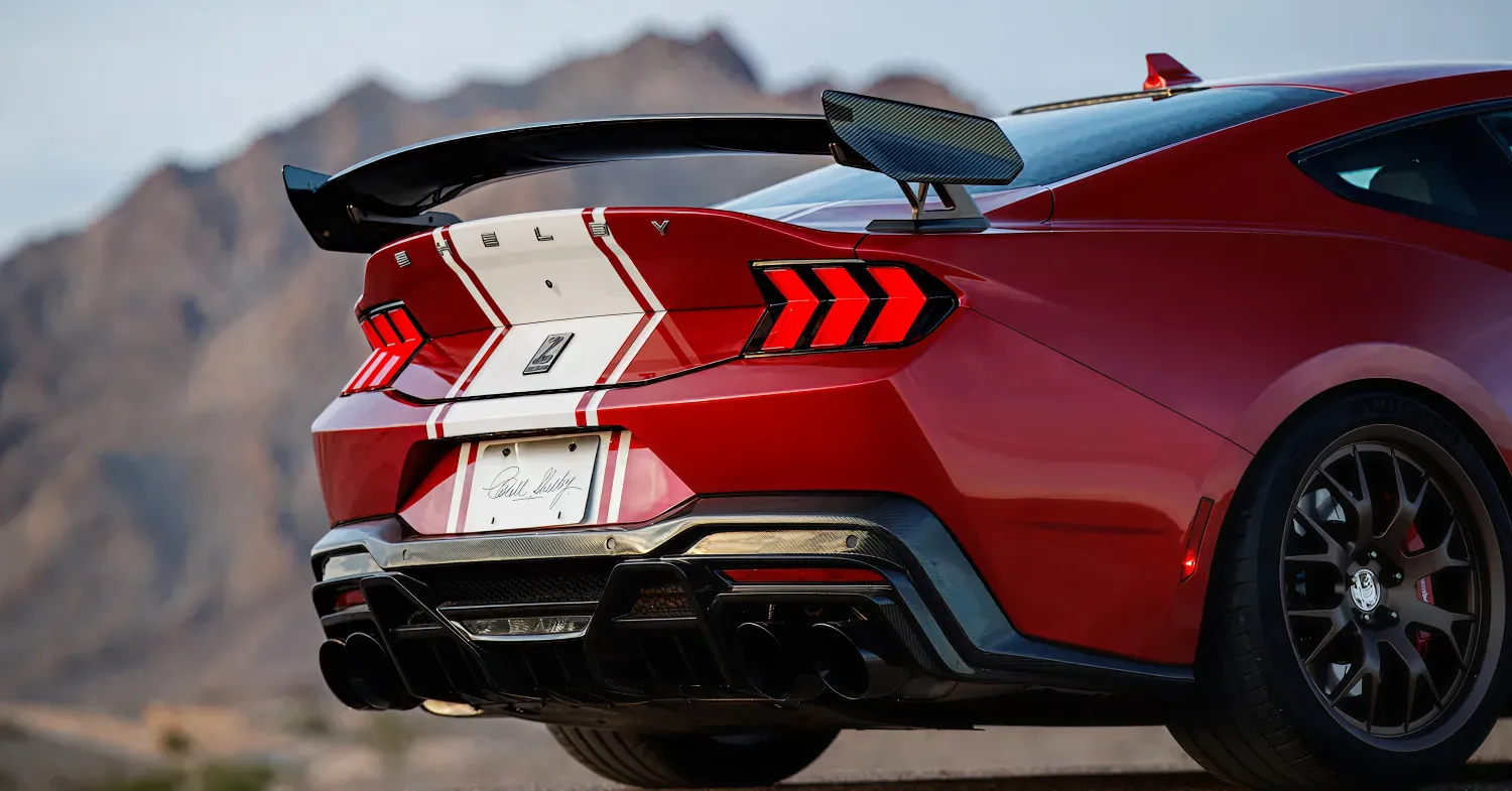 Red sports car with rear spoiler and stripes
