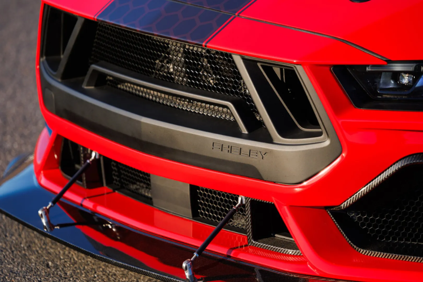 Close-up of red Shelby Mustang front grille