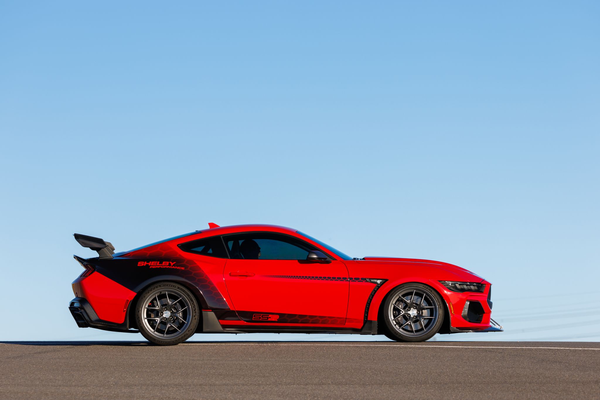 Meet the 2026 Shelby Super Snake R, available in right hand drive only from Autogroup International, the world’s only authorised partner. Built on the Mustang Dark Horse platform, it unleashes 850+ hp from a supercharged 5.0-litre V8 with a Tremec 6-speed manual or 10-speed automatic, adjustable coil-overs, spherical bearings and forged magnesium wheels. Carbon fibre aero and a widebody stance deliver race car precision, while our mirror-image right hand drive conversion meets full ADR compliance under an ISO 9001:2015 quality system. Factory backed Australian support includes a 5-year unlimited kilometre warranty and 24/7 roadside assistance.