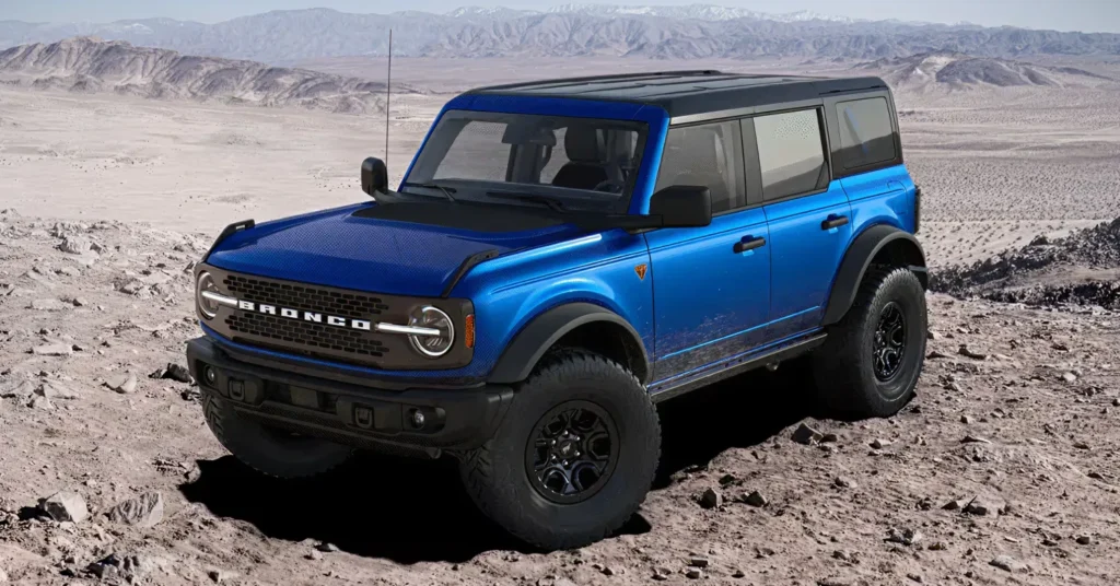 Blue Ford Bronco in rocky desert landscape